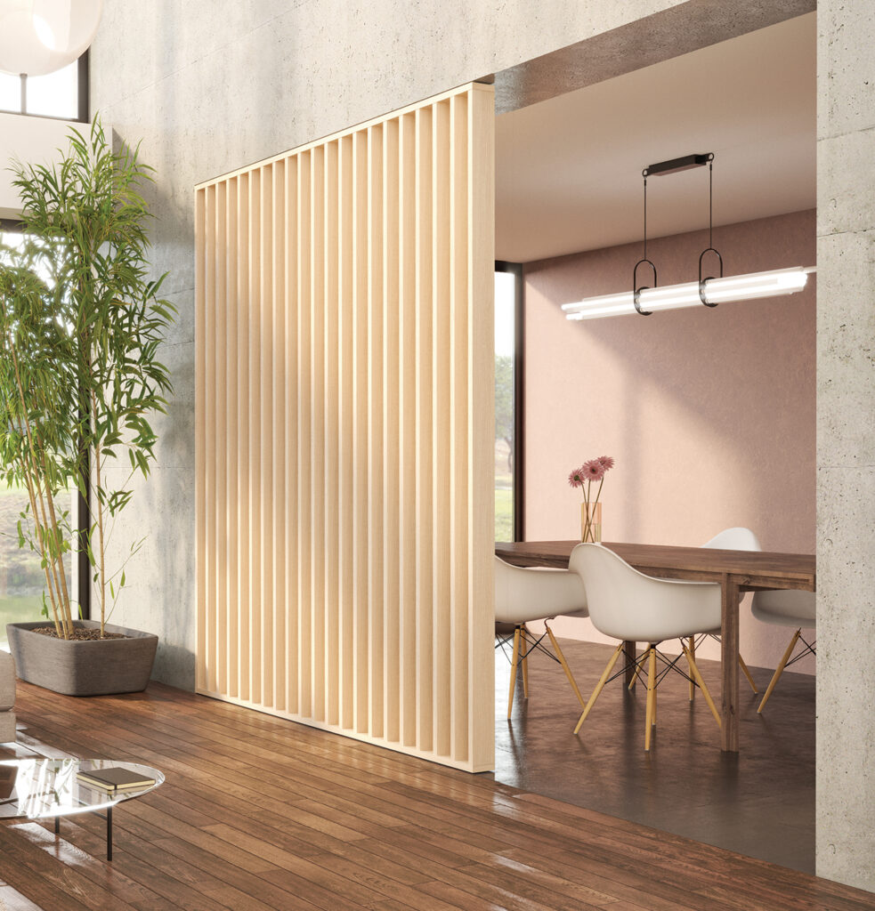 Image d'une salle de réunion et d'un open space séparée en deux grâce à un claustra.